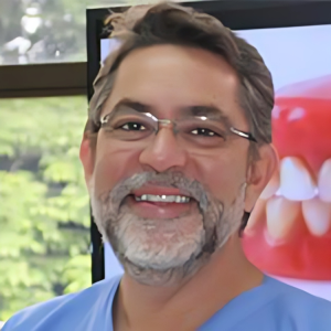 Dr. Arturo Acosta, skilled dentist providing expert care at DentaVac Dental Clinic.